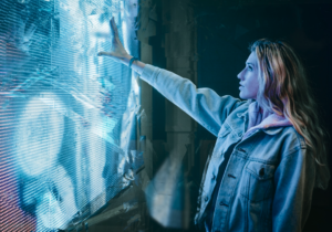 Woman reaching out to futuristic screen